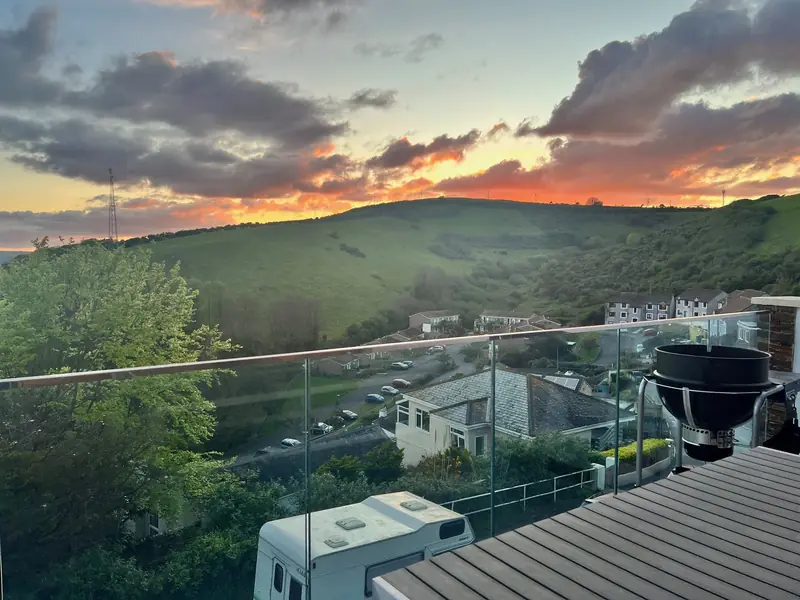 Sunset over the Cornish hills from Sunkeeper's glass balcony